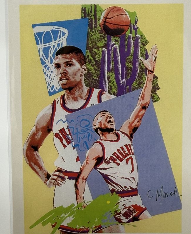 Illustrated Phoenix Suns basketball card showing two players in Phoenix jerseys, signed by the artist, in a plastic sleeve